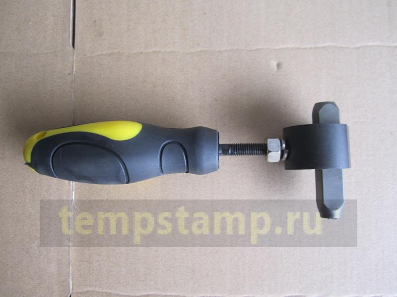 "Safety handle for impact stamps"